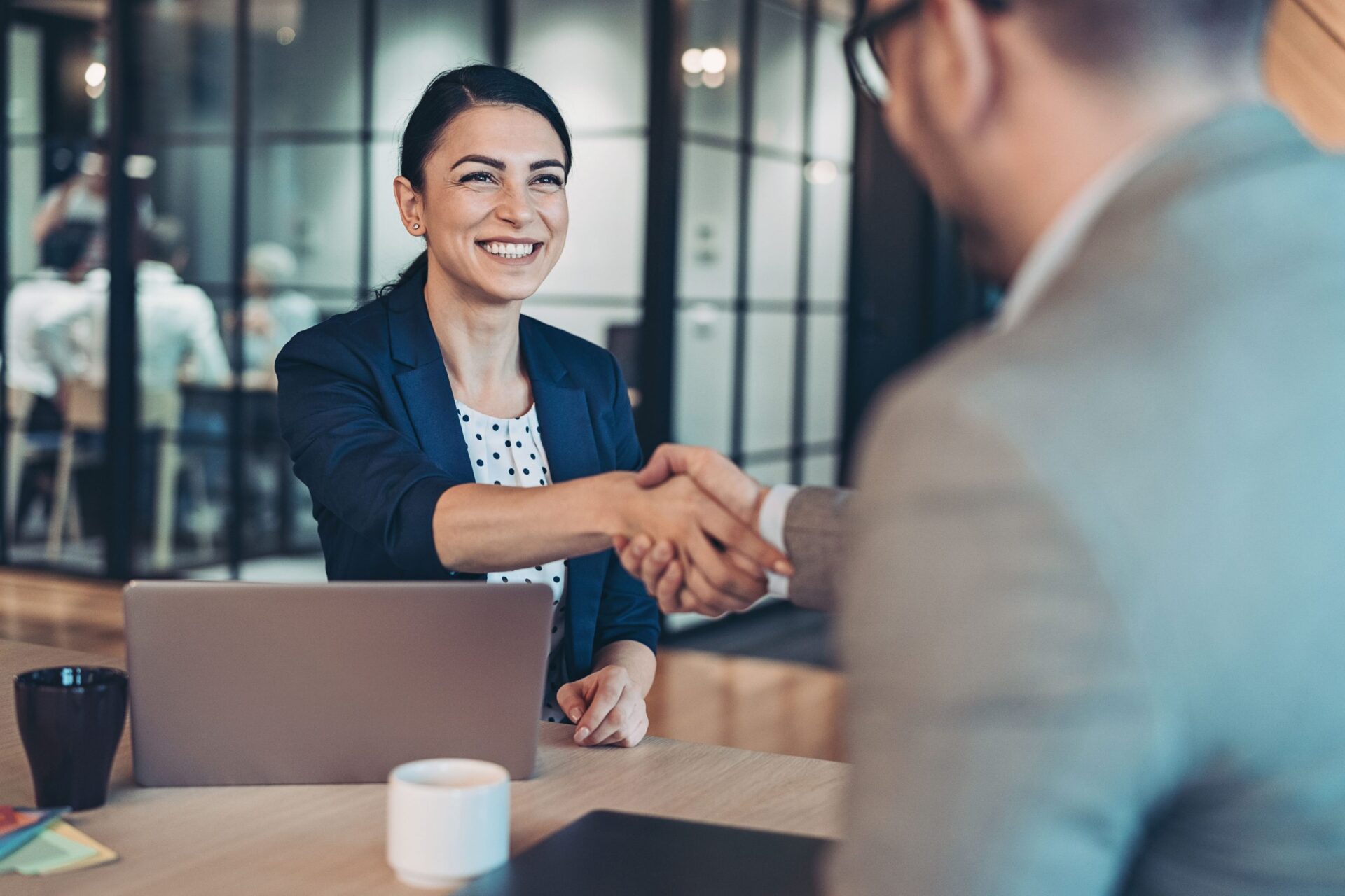 man and woman handshake on new agreement