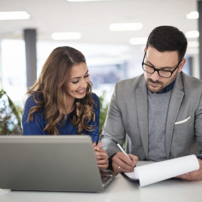 Young business people in modern office working on a solution and Young business people in modern office working on a solution and