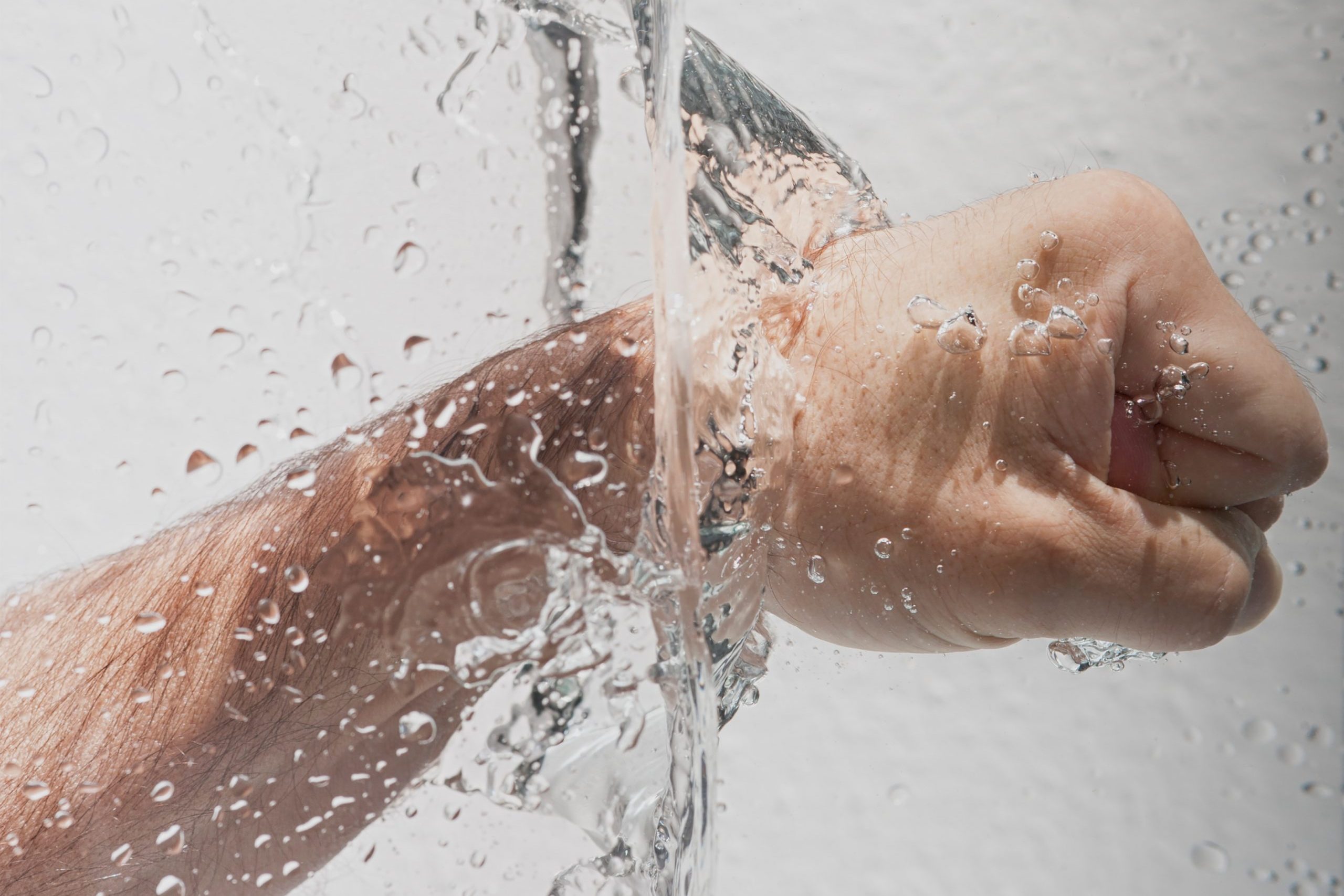 Man punching through water