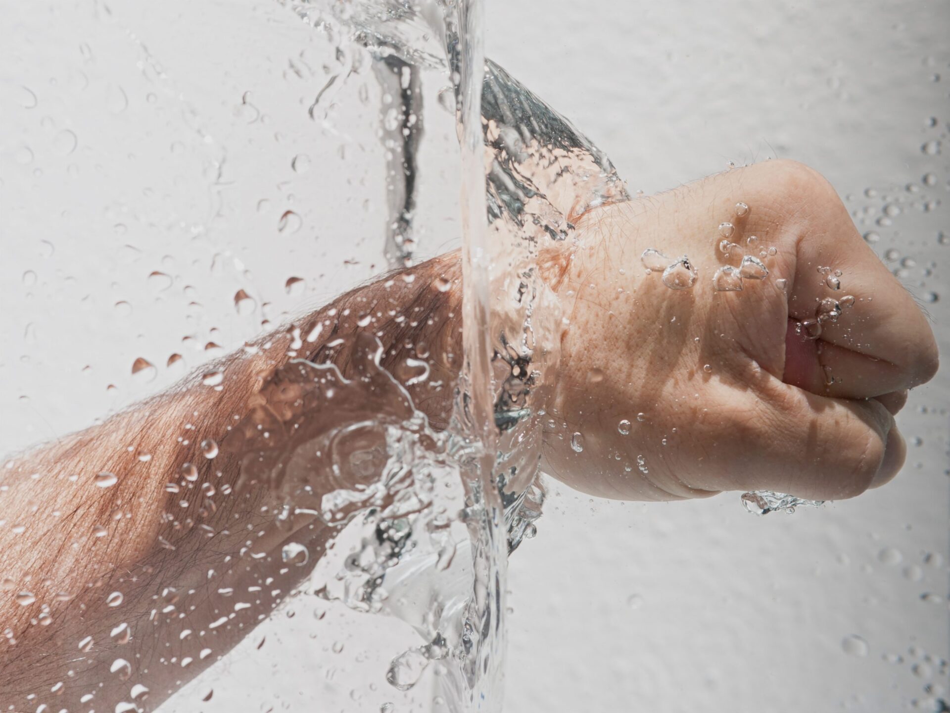 Man punching through water