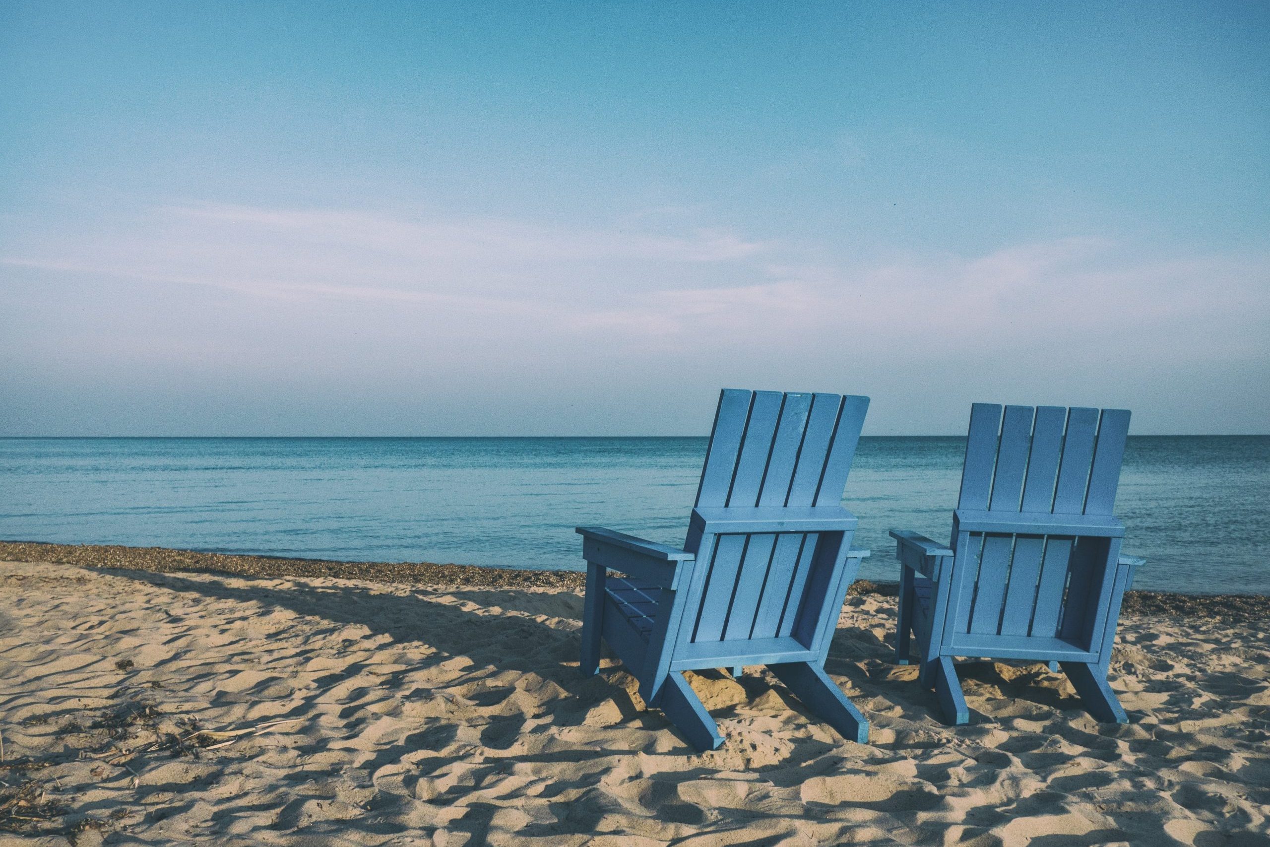 beach chairs near the water